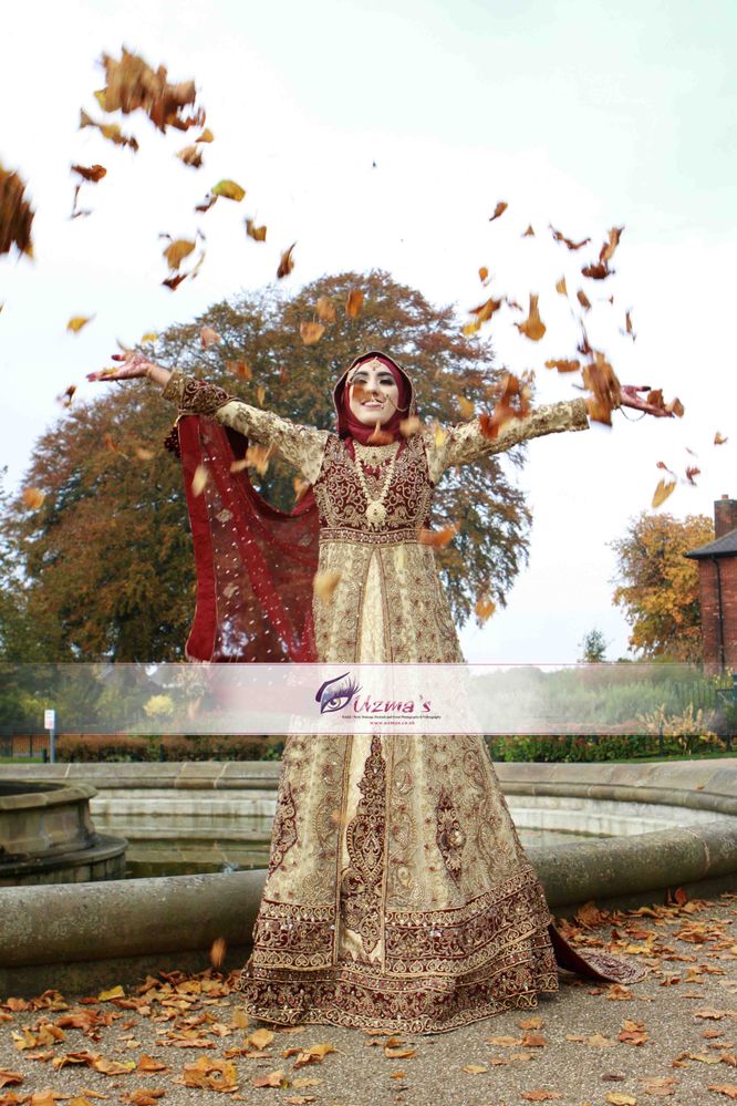 A British Muslim Bride throwing leaves in air.jpg