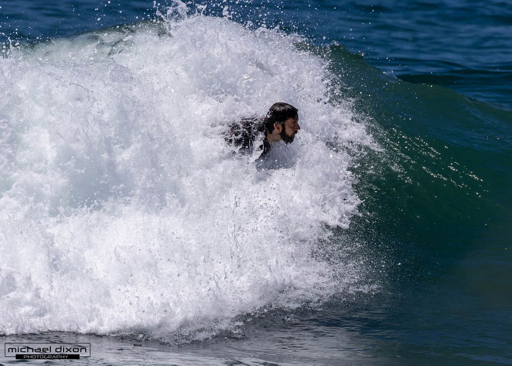 bodysurfer coasting in to shore
